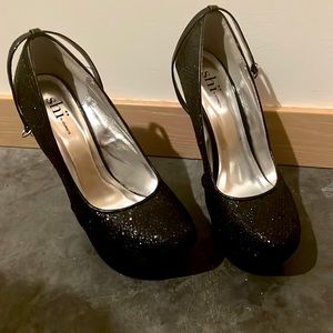 Shï by Journey heel-less platforms in black sparkle